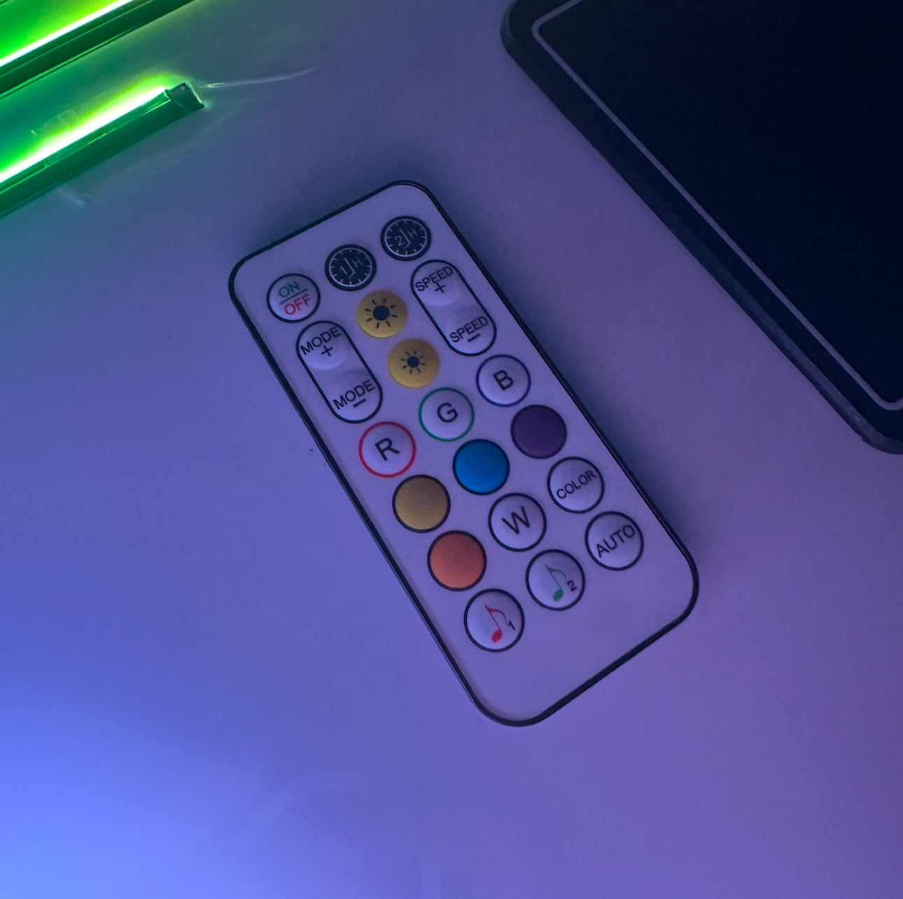 “RF remote control for Universal Ambient Lighting Kit with on/off, mode, speed, brightness, RGBW color and music‑sync buttons”