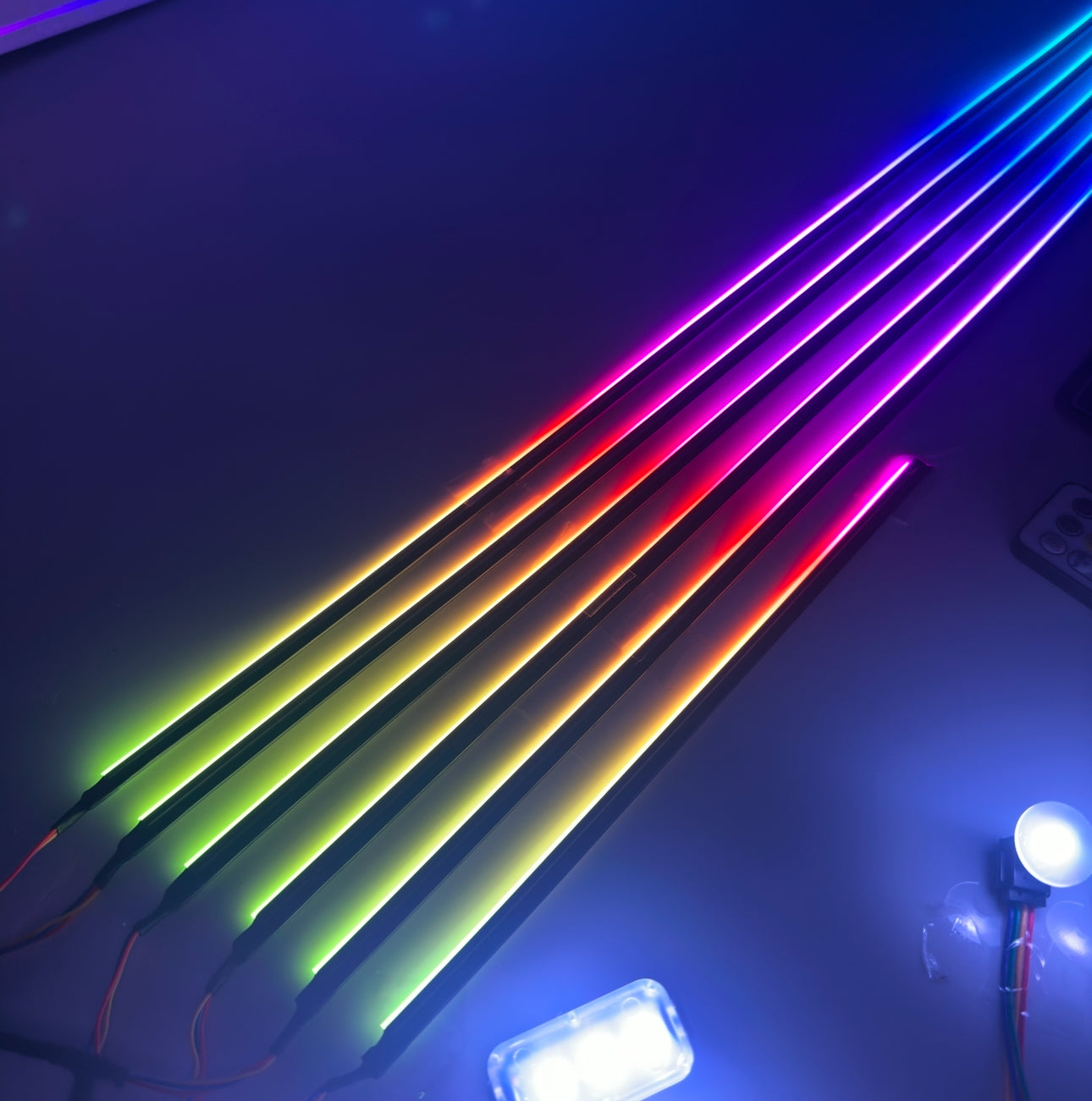 “Universal ambient lighting kit LED strips displaying a vibrant multi‑color gradient for car interior accent lighting”